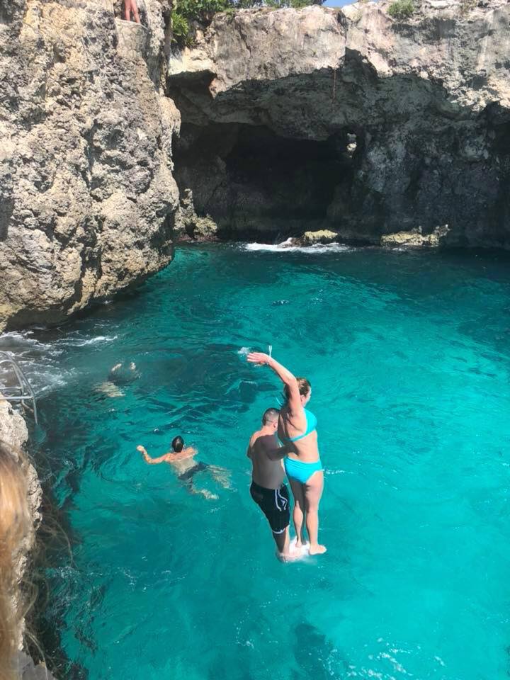 Chris with husband, Brett, cliff jumping in Cozumel