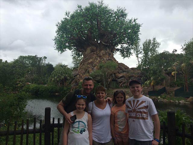 Chris and family in front of the Animal Kingdom's Tree of Life